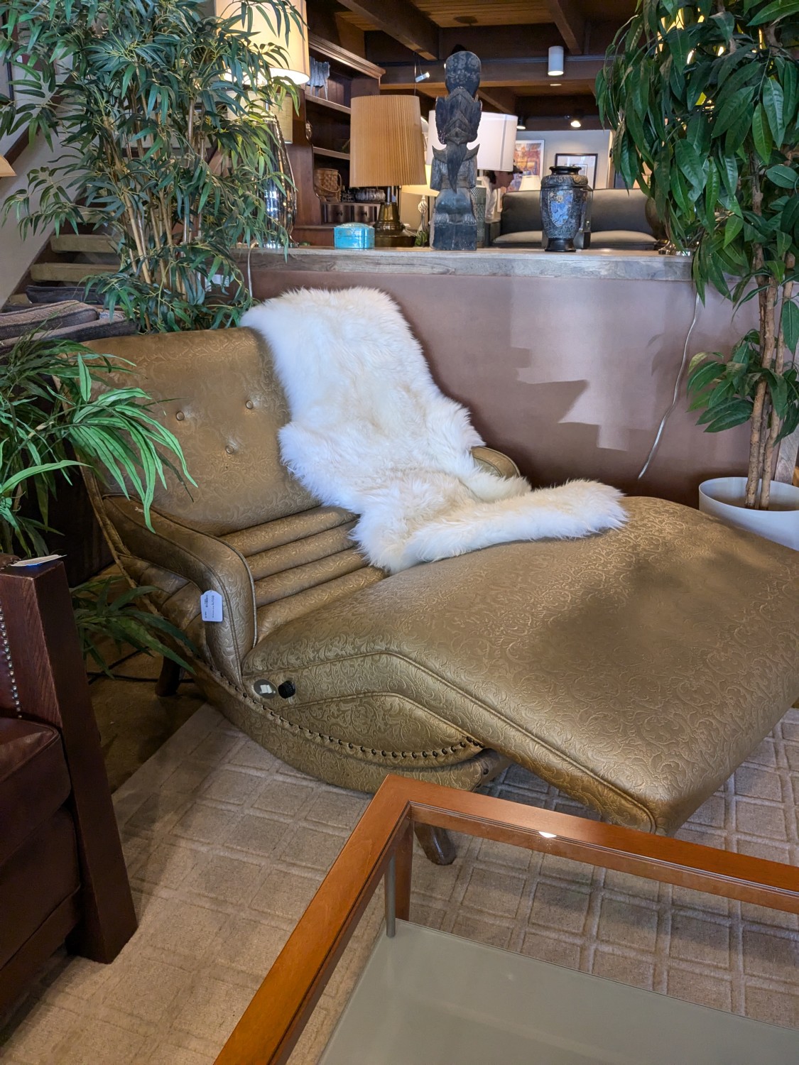 A couch with a white fur on it Description automatically
generated